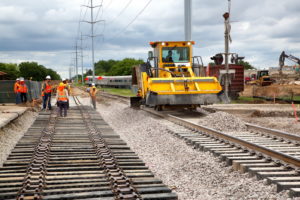 Construction workers working on the new train tracks in Grapevine, Texas