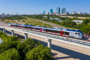 TEXRail train with downtown Fort Worth in background