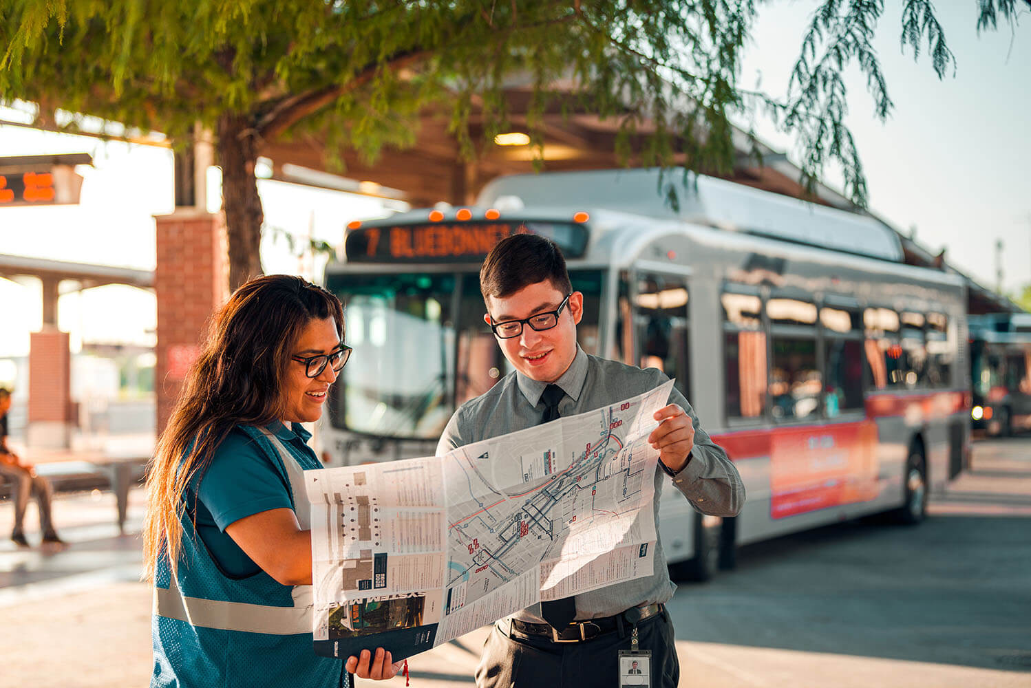 Two people searching a transit map